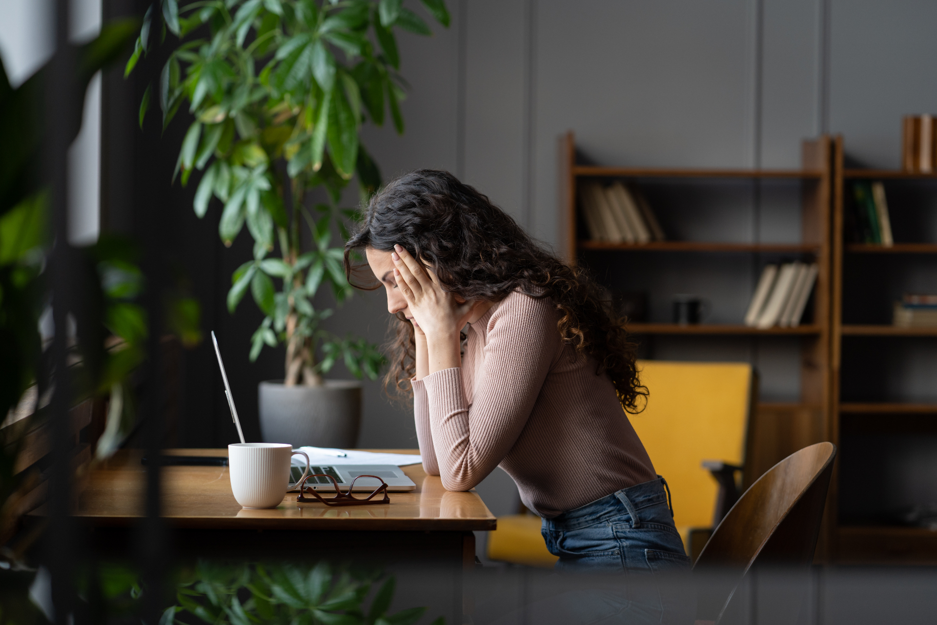A creative business owner feeling overwhelmed by admin work